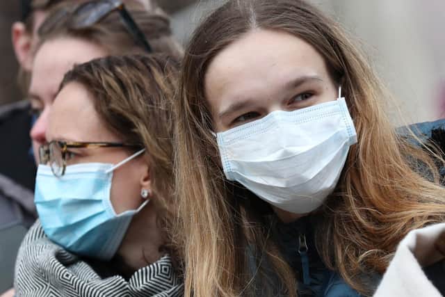 People wearing face masks amid concern about the spread of coronavirus (pic: Jonathan Brady/PA Wire)