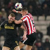 Sheffield United's Oli McBurnie (left) and Sunderland's Daniel Ballard battle for the ball during the Sky Bet Championship match at the Stadium of Light: Owen Humphreys/PA Wire.