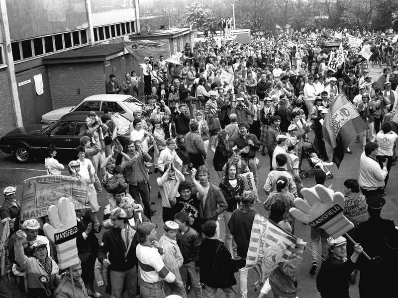 Stags fans wait outside Field Mill for their returning heroes.