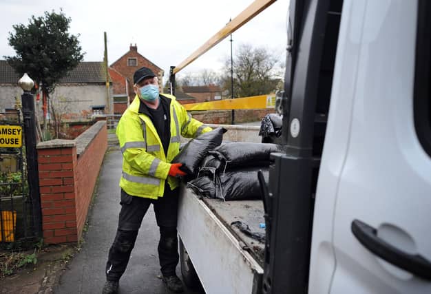 A Doncaster Council worker pictured delivering Sandbags to residents in Fishlake. Picture: NDFP-19-01-21-FloodAlert Fishlake 2-NMSY
