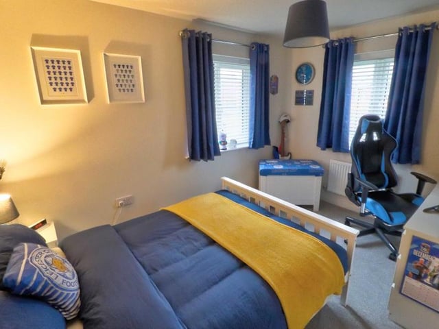 Full of colour, the second double bedroom at the Shirebrook property is a generous size. There are two uPVC double-glazed windows, plus a carpeted floor.