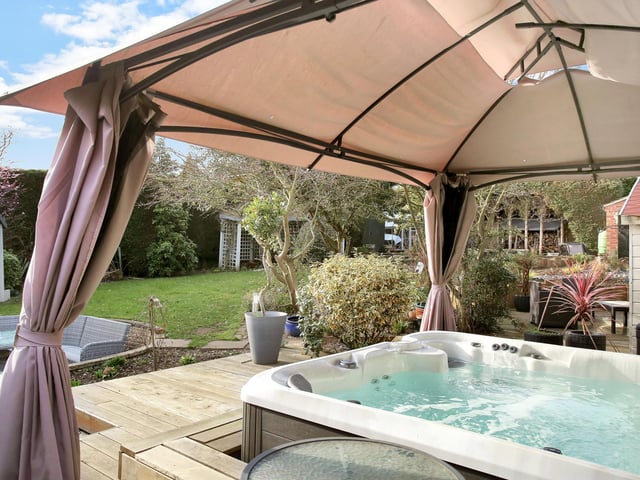 There is also a raised decking area with hot-tub spa.