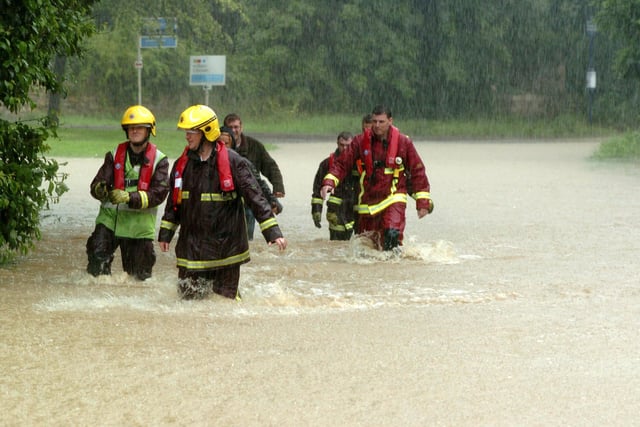The Fire and rescue service  visit properties in the village during the Brodsworth Floods  in 2007