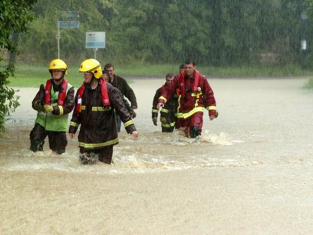 The Fire and rescue service visit properties in the village during the Brodsworth Floods in 2007