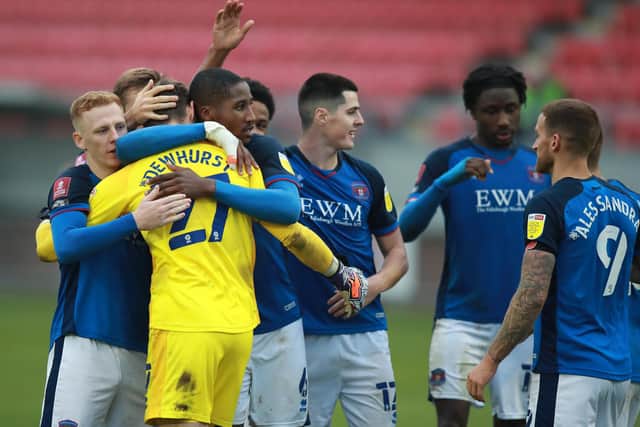 Sheffield United goalkeeper Marcus Dewhurst, on loan at Carlisle United, celebrates with his Blues team-mates after pulling off two saves in a penalty shootout win over Hayes & Yeading in the FA Cup first round on Saturday. (Photo by David Rogers/Getty Images)