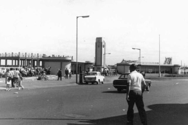 A 1970s view of the crowds seated at the bus station at Seaton Carew with the roller coaster in the distance. Photo: Hartlepool Library Service.