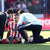 Billy Sharp, the Sheffield United captain, receives treatment during the win over Barnsley: Darren Staples / Sportimage