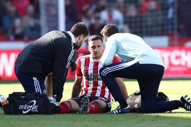 Billy Sharp, the Sheffield United captain, receives treatment during the win over Barnsley: Darren Staples / Sportimage
