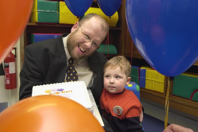 Doncaster Health Authority Chief Executive John McIvor and three-year-old Adam Turner are pictured with the Sure Start cake, baked to mark the opening of the Sure Start premises in Church Road, Denaby Main.