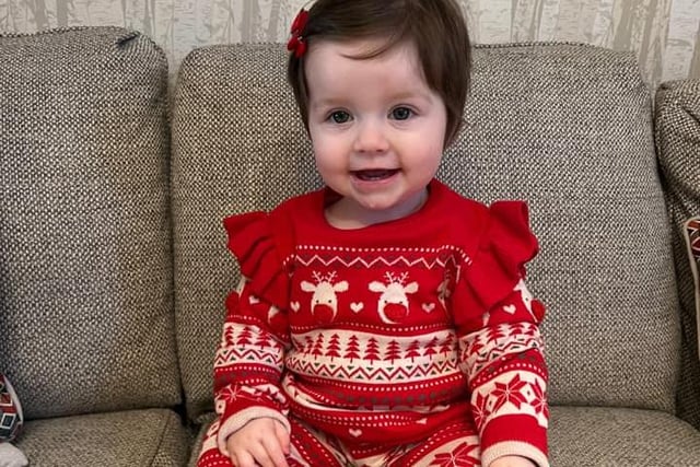 A smart Christmas outfit - and matching bow - for Ottilie's first festive season.