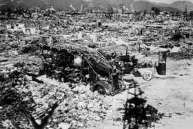 Atomic bomb damage at Hiroshima in 1945 with a burnt out fire engine amid the rubble