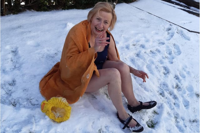 Sybil Mountford braved the cold by making a snow angel in her garden on her 74th birthday to raise money for Alice House Hospice. r
