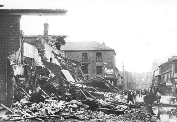 German bombers devastated this street but local residents were always on hand to help with the clear-up.