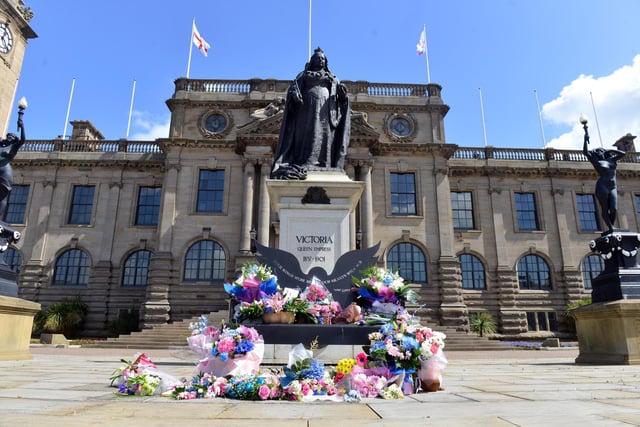 Dozens of pink and blue flowers were left outside of South Shields Town Hall.