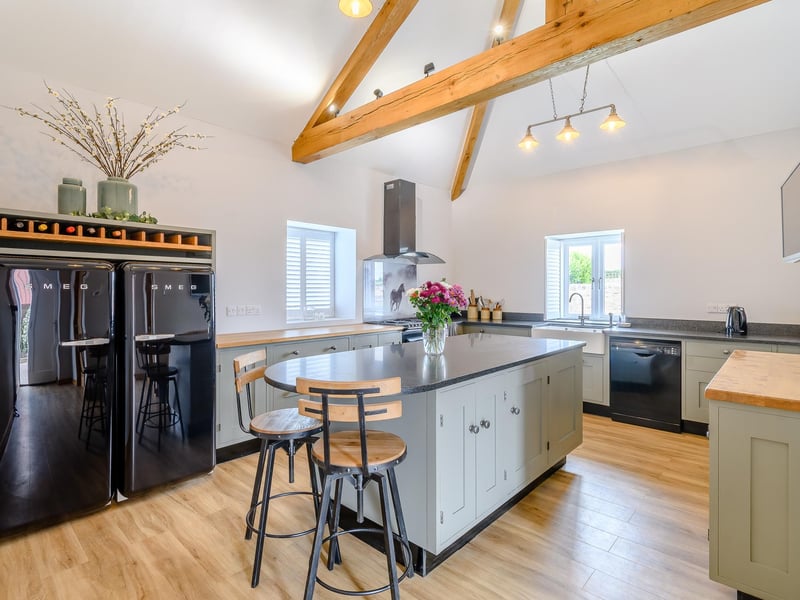 The high-quality kitchen area in the residential stone barn at Warren Farm. It features all the modern amenities required.