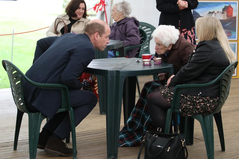 Prince William chats to resident Betty Magee(96) and her granddaughter Kimberley Anderson during a visit to the Queen's Bay Lodge Care Home in Edinburgh on May 23. The home is run by the Church of Scotland through Cross Reach, to meet with staff, residents and families to hear about the impact of Covid-19 on the home.
