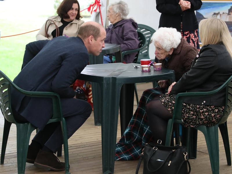 Prince William chats to resident Betty Magee(96) and her granddaughter Kimberley Anderson during a visit to the Queen's Bay Lodge Care Home in Edinburgh on May 23. The home is run by the Church of Scotland through Cross Reach, to meet with staff, residents and families to hear about the impact of Covid-19 on the home.