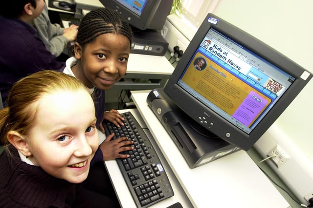 Park Primary School pupils Nicola Cooke, aged 11, and Nomsa Masamvi, aged ten, take part in a World Book Day event at Wheatley Library in 2004
