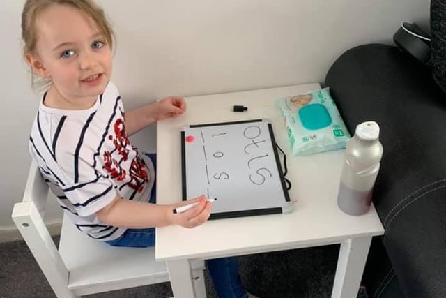 Amelia, four, from Biddick Hall Infants' School, busy with her phonetics.