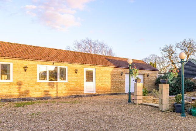 The property also has a separate outbuilding, which currently features a large garage adjoining a spacious games room.