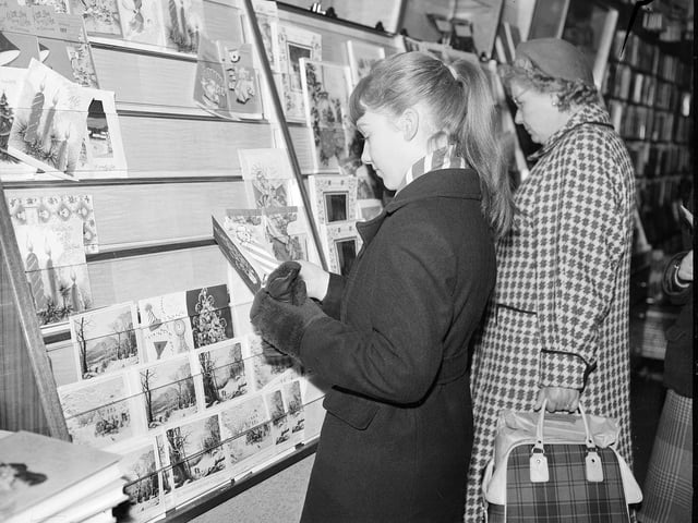 A woman Christmas card shopping in Edinburgh City Centre in 1959.