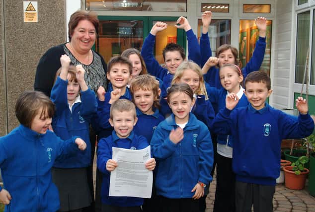 Woodsetts Primary School school received an excellent report in a recent Ofsted visit.
Picture: Head teacher Mrs Green with pupils celebrate the report in 2007