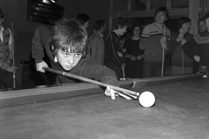 Young snooker player Stephen Hendry prepares to strike the cue ball in March 1982.