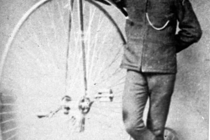 A Sheffield postman with his penny farthing bicycle, taken between 1900-1919.
