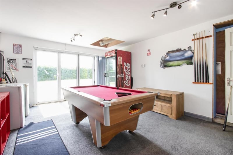 The annexe boasts two reception rooms, one of which is currently used as a games room.