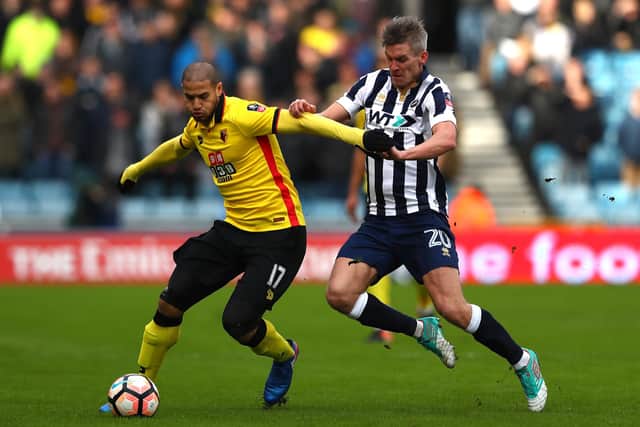 LONDON, ENGLAND - JANUARY 29: Adlene Guedioura of Watford (L) holds back Steve Morison of Millwall (R) during The Emirates FA Cup Fourth Round match between Millwall and Watford at The Den on January 29, 2017 in London, England.  (Photo by Matthew Lewis/Getty Images)