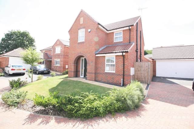 The house on Periwinkle Road, Wingerworth, has a double garage and off-road parking space.