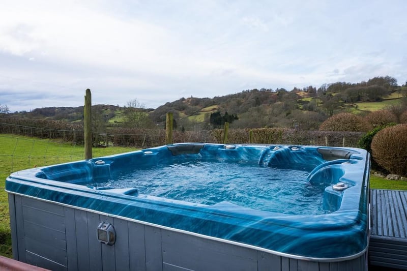 Homeowners can relax and bask in the scenic views overlooking the fields in their own hot tub.