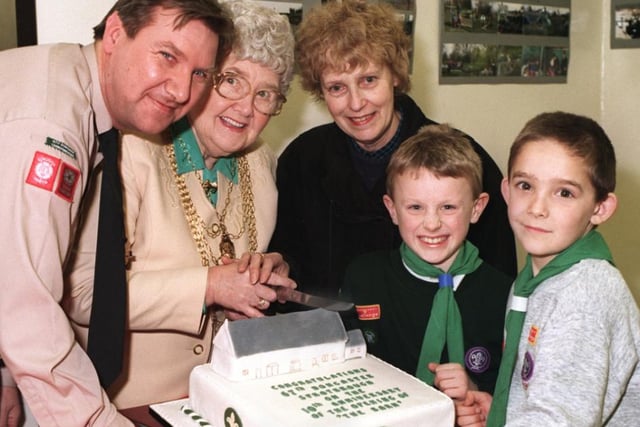 The mayor of Doncaster cutting a celebration cake in 1997 to mark ten years since the 67th Doncaster Scout Group moved into  The Barn