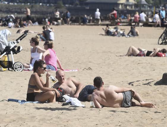 Locals soak up the sun on Portobello Beach.