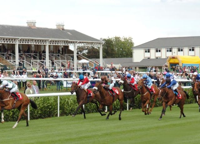 Jockeys on horses during the 2007 St Leger Day races.