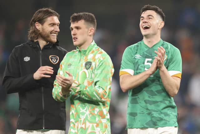 Republic of Ireland's John Egan, right, greets the fans at the end of the match between Ireland and Belgium at the Aviva Stadium in Dublin (AP Photo/Peter Morrison)