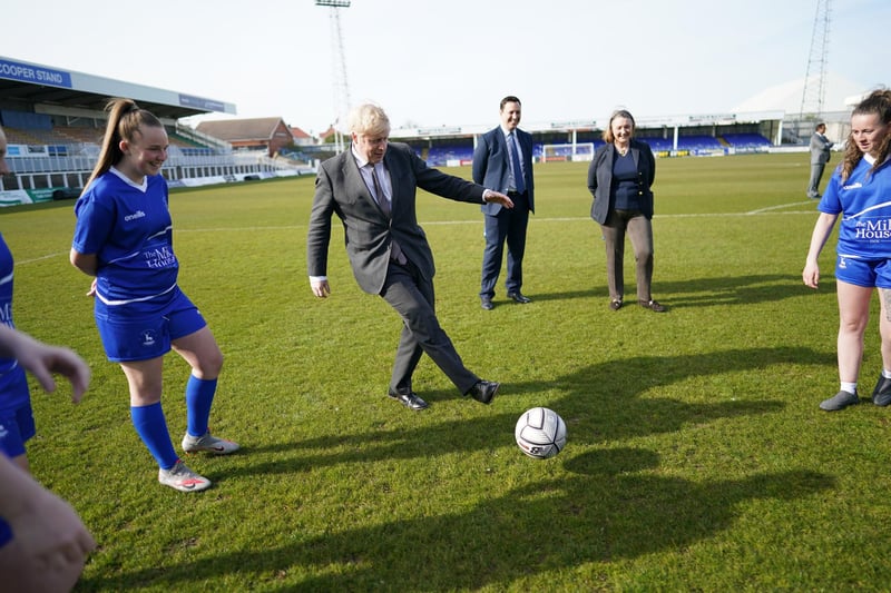 Jill Mortimer, Conservative party candidate for Hartlepool and Prime Minister Boris Johnson, kicking a football with team members of the Hartlepool United Ladies Team during a visit to the Hartlepool United Football Club, in Hartlepool, ahead of the May 6 by-election. Picture date: Friday April 23, 2021.