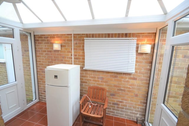 Conservatory -  10' 10" x 6' 1" (3.3m x 1.85m) A useful addition to the property providing extra space with front and rear UPVC double glazed doors, polycarbonate roof, various power sockets, central heating radiator, wall lighting and a tiled floor.