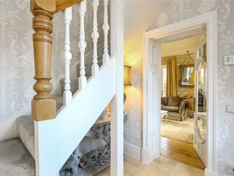 The property is entered through reclaimed glass doors to a light and airy hallway.