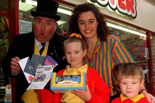 Pictured at Toymaster Toy in 1997 where  Elizabeth Watkins age 8 from Beighton received tickets for four to go on a Weekend to Paris on Euro Star. Elizabeth won the national colouring competition to colour in a picture of Thomas the Tank Engine. Seen is Sir Topham Hatt the Fat Controller who presented the prize with Shop manager Jeanette Saville. also seen is Elizabeth's brother Lloyd age 5.