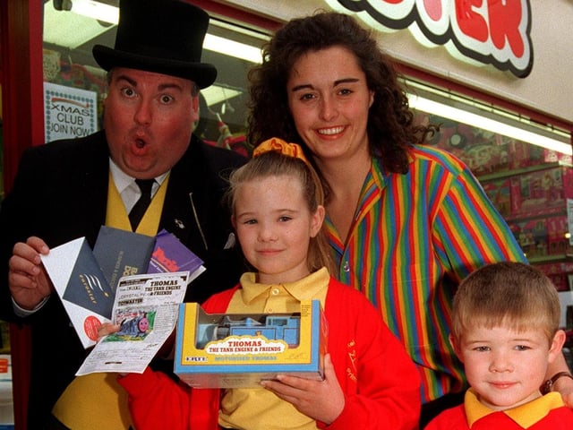 Pictured at Toymaster Toy in 1997 where Elizabeth Watkins age 8 from Beighton received tickets for four to go on a Weekend to Paris on Euro Star. Elizabeth won the national colouring competition to colour in a picture of Thomas the Tank Engine. Seen is Sir Topham Hatt the Fat Controller who presented the prize with Shop manager Jeanette Saville. also seen is Elizabeth's brother Lloyd age 5.