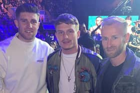 Boxer and Sheffield Wednesday fan Dalton Smith (centre) with Owls pair Josh Windass (left) and Barry Bannan.