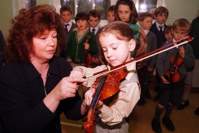 Pictured at  Birkdale School, Clarke Drive in 1998 where Violin Teacher Iona Sherwood-Jones is seen with Olivia Moore  five, and the rest of a new class.
