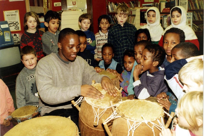Luganda Sibandar demonstrates Caribbean drums to pupils of Springfield School during Sheffield Afro-Caribbean Festival on February 12, 1995. Ref no: s26529