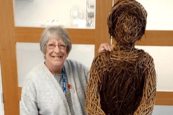 Janet Devanny, Lily Brandreth’s daughter, with the wicker sculpture honouring her mum and hundreds o