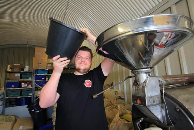 Pictured is Frazer Habershon with the coffee roaster. Picture: Chris Etchells