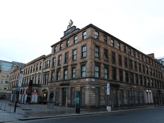 An empty Glasgow city centre at the junction of John Street and Cochrane Street at 9.06 am the morning after stricter lockdown measures came into force