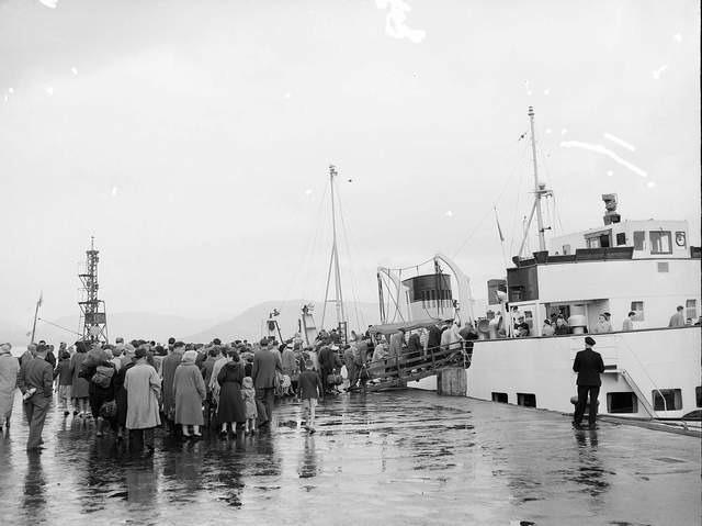 Holiday makers board the steamer at Gourock for Dunoon in the rain during the Glasgow Fair holiday in 1959.