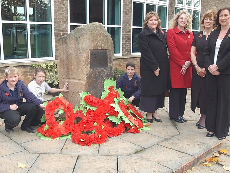 Pupils Kieran Hollingsworth, Natalie Colligan and Emily Wild are pictured with guests Jill Hanson and Helen Bradley, from the Mansfield branch of the Derbyshire Building Society, headteacher Mrs Davis and governor Julia Yemm at the school's remembrance service.