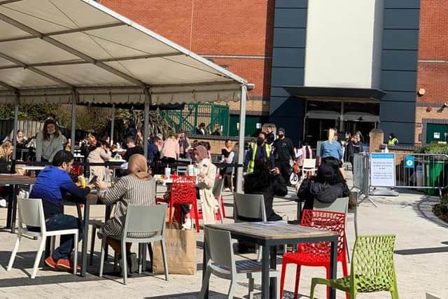 Shoppers consuming food and drinks in the outdoor dining area at Meadowhall, which is being expanded